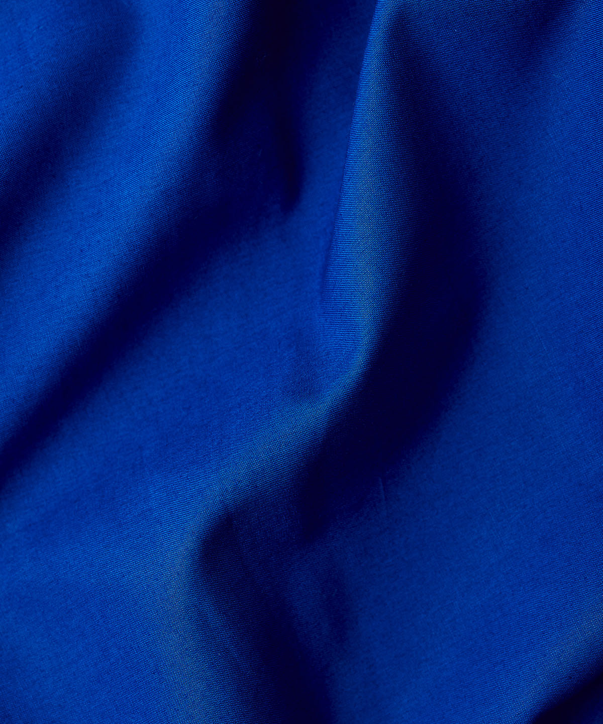 Bright blue bed linen close up fabric