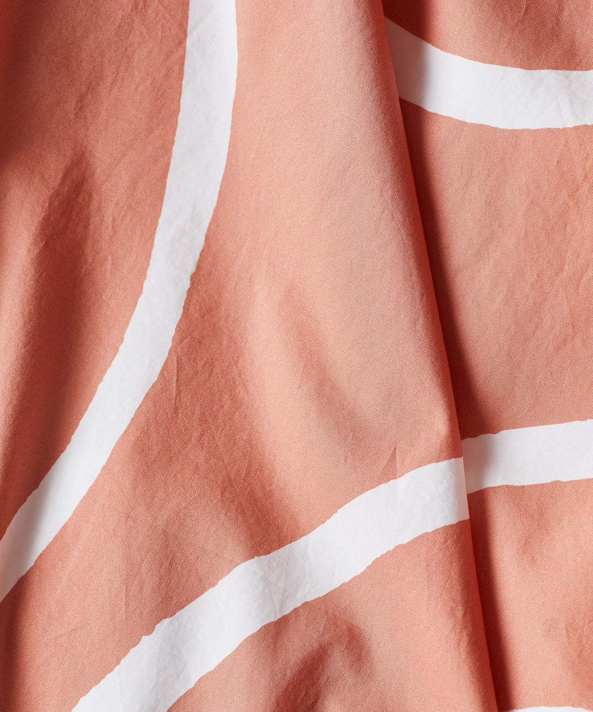 Terracotta white lines bed linen fabric detail